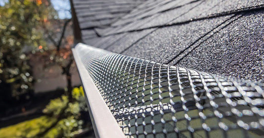 expanded metal k style gutter guard installed on roof gutter